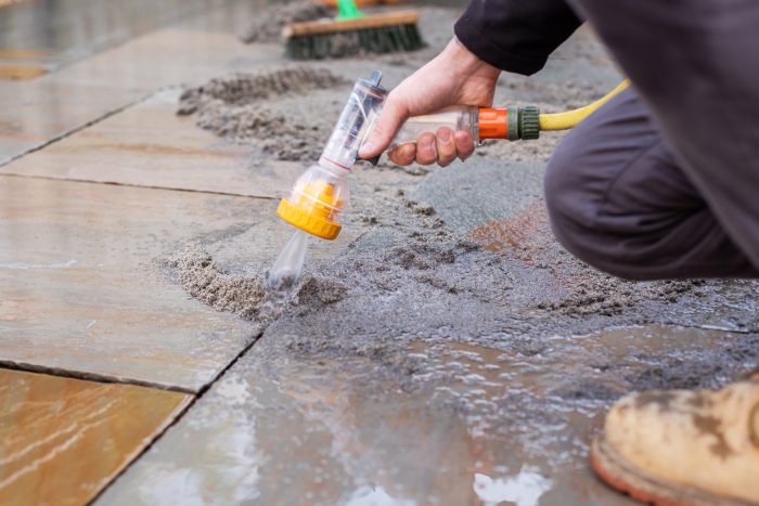 Spraying jointing compound with a hose