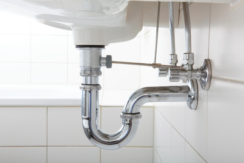 The difference between bathroom and kitchen sinks. Underneath a bathroom sink and it's plumbing.