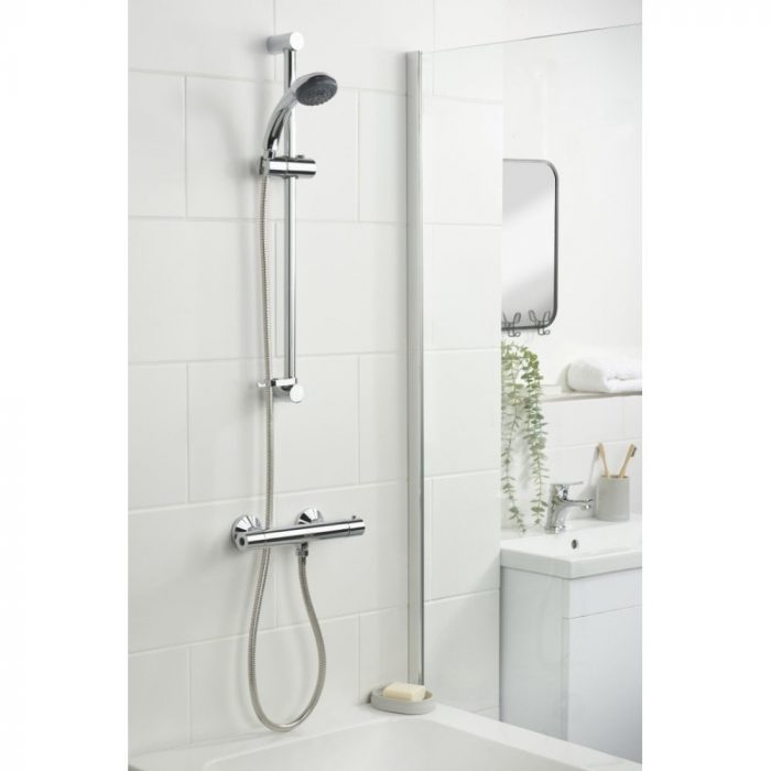 Exposed bar shower with slider rail and handheld shower hose.