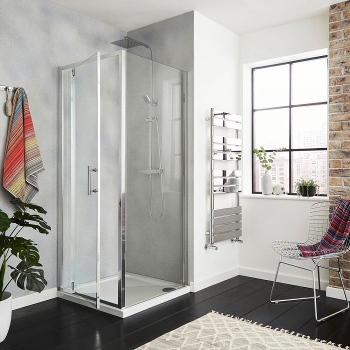 Square corner cubicle shower with a pivot door