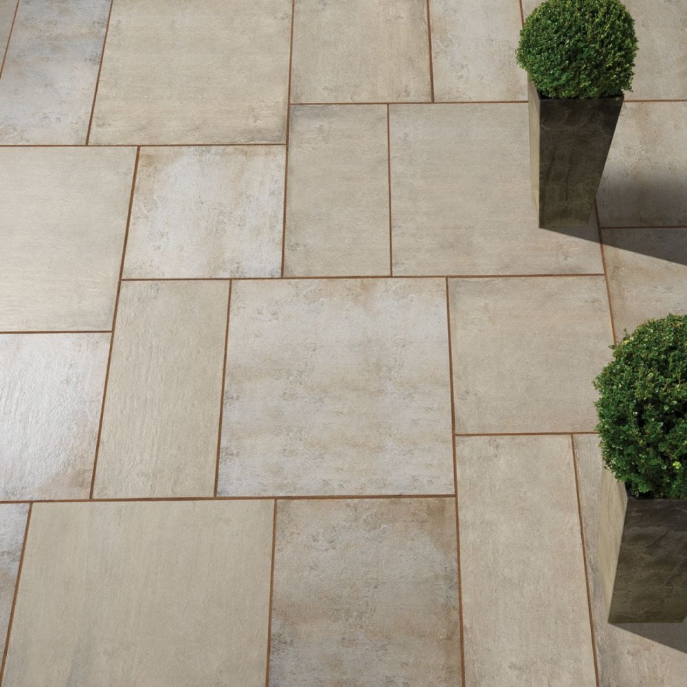 How do I remove the mud stains from my new porcelain patio tiles?